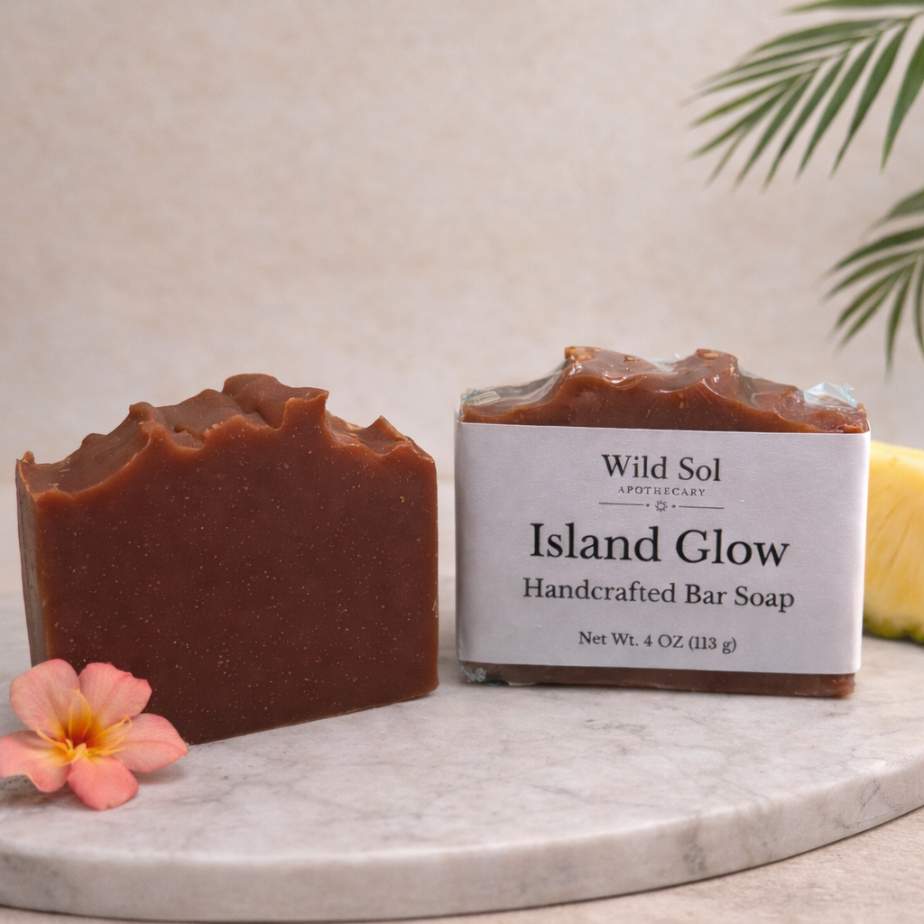 Handcrafted bar soap with a label on a marble surface, featuring a tropical flower.